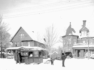 A horse drawn mail car on College Avenue, Houghton, 1924